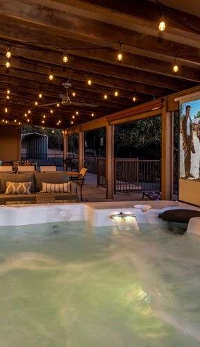 Mountain Elegance hot tub with outdoor projector screen